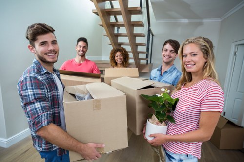Professional home moving service in Westhampstead with packed boxes and furniture