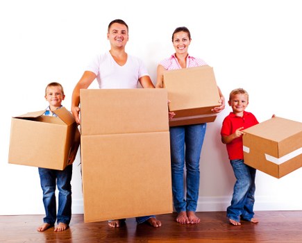 Removal van and moving boxes in a Westhampstead street setting