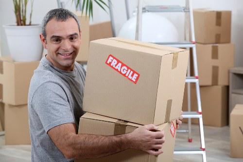 Office relocation planning in West Hampstead with desks and packing crates