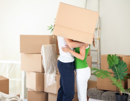 Packed boxes and furniture ready for transport in a local move