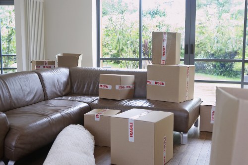 Careful handling of boxed household items during a local removal